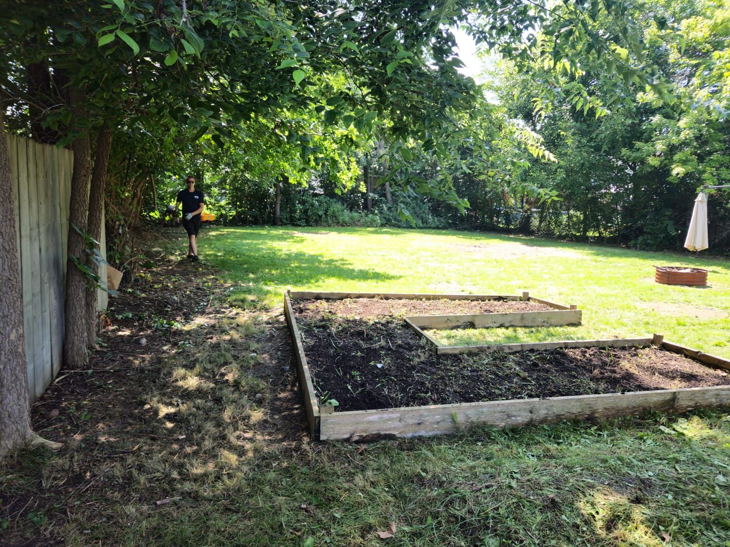 A raised garden bed topped up with fresh soil