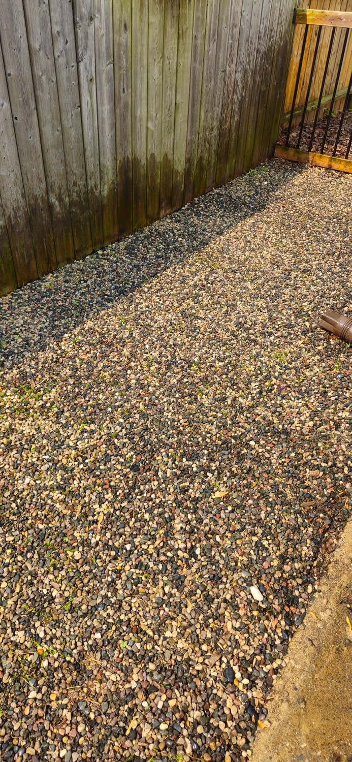 A finished decorative stone and gravel area